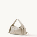 Small Drippy Roof Bag in Ivory pebble-grain leather with adjustable strap and metallic logo detail.