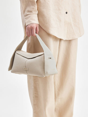 Small Drippy Roof Bag in Ivory, made from full-grain leather with a structured shape and a minimalist design.