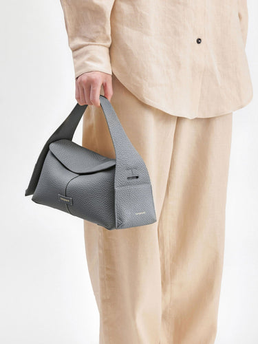 Grey full-grain leather Small Drippy Roof Bag with tan linen outfit