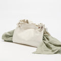 Cloud Small Gather Bag Set in soft leather with draped green fabric.