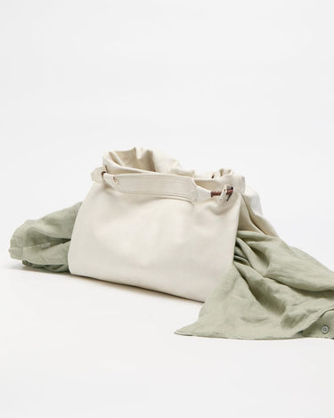 Cloud Small Gather Bag Set in soft leather with draped green fabric.
