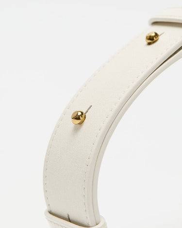 Close-up of a white leather strap with gold stud detailing, part of the Small Gather Bag Set.