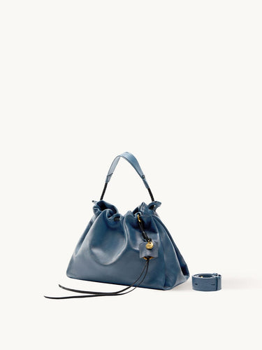 Navy Small Gather Bag Set with drawstring, leather strap, and gold charm.
