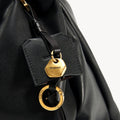 Black leather Small Gather Bag Set with gold hardware and Songmont logo tag.