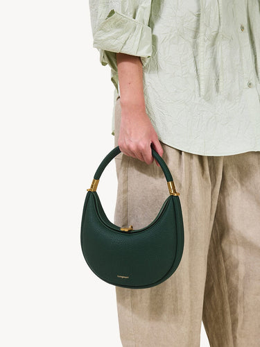 Emerald green pebble-grain Small Luna Bag with gold hardware and clasp. Handheld with rounded strap.