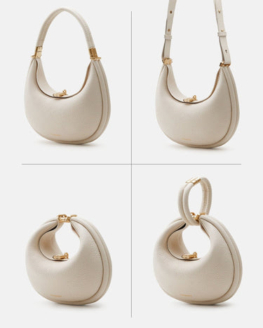 Ivory Small Luna Bag made of full-grain leather with gold hardware. Versatile design with multiple carrying options.