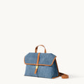 Small Shan Satchel Bag in denim with tan leather trim and strap.
