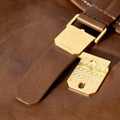 Small Shan Satchel Bag in brown leather with gold hardware and engraved latch
