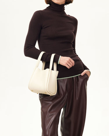Cream full-grain leather Small Song Bag with gold hardware and magnetic closure.