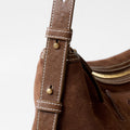 Small Yore Hobo Bag minimal version in Sandal Suede, showing leather strap with white stitching and gold hardware.