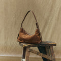 Small Yore Hobo Bag in Sandal Suede, crafted from cow suede leather with vegetable-tanned leather accents.