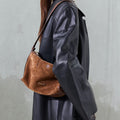 Small Yore Hobo Bag in Sandal Suede, crafted from cow suede leather with vegetable-tanned leather accents.
