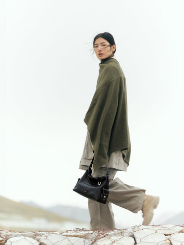 Small Yore Hobo Bag in Onyx crafted from vegetable-tanned leather, featuring adjustable strap and multiple pockets.
