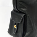 Small Yore Hobo Bag in Onyx black vegetable-tanned leather with white stitching and gold hardware.