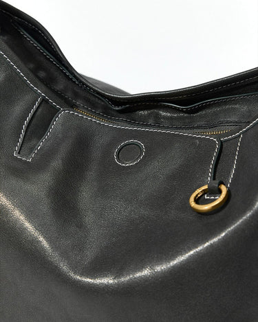 Small Yore Hobo Bag in black leather with white stitching and gold hardware