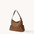 Small Yore Hobo Bag in Sandal color, made from vegetable-tanned leather with exterior flap pockets and adjustable strap.