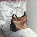Brown Small Yore Hobo Bag in Sandal color, vegetable-tanned leather, gold hardware, adjustable strap.