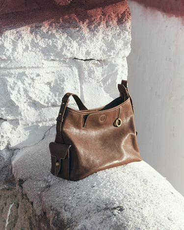 Brown Small Yore Hobo Bag in Sandal color, vegetable-tanned leather, gold hardware, adjustable strap.