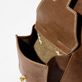 Brown leather Small Yore Hobo Bag interior lining with camouflage pattern and gold hardware detail.