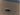 Striped cylindrical object on a textured surface
