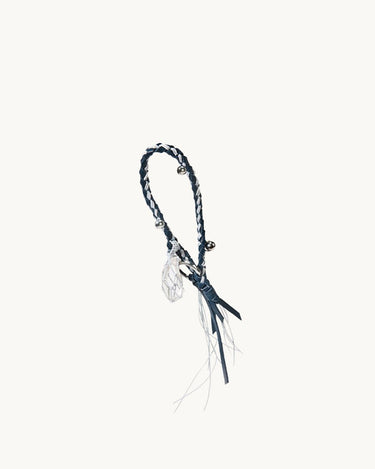 Tranquil Crystal Charm with braided cord, silver bells, and leather tassels.