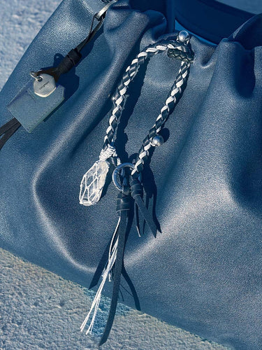 Tranquil Crystal Charm: blue leather bag, braided charm, crystal pendant, Moonstone color, Songmont tag.