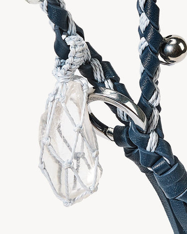 Tranquil Crystal Charm: clear crystal, macrame net, navy braided leather strap, silver ring, moonstone charm.