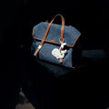 Vegan Charm bag in Whale (Eco Cloud) color with a white whale charm attached.