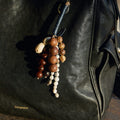 Denim Wish Seeds Charm crafted from full-grain leather with a beaded charm featuring natural Bodhi seeds.