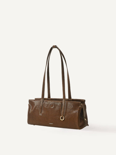 Yore Baguette Bag in Sandal leather with contrasting stitching and gold hardware.